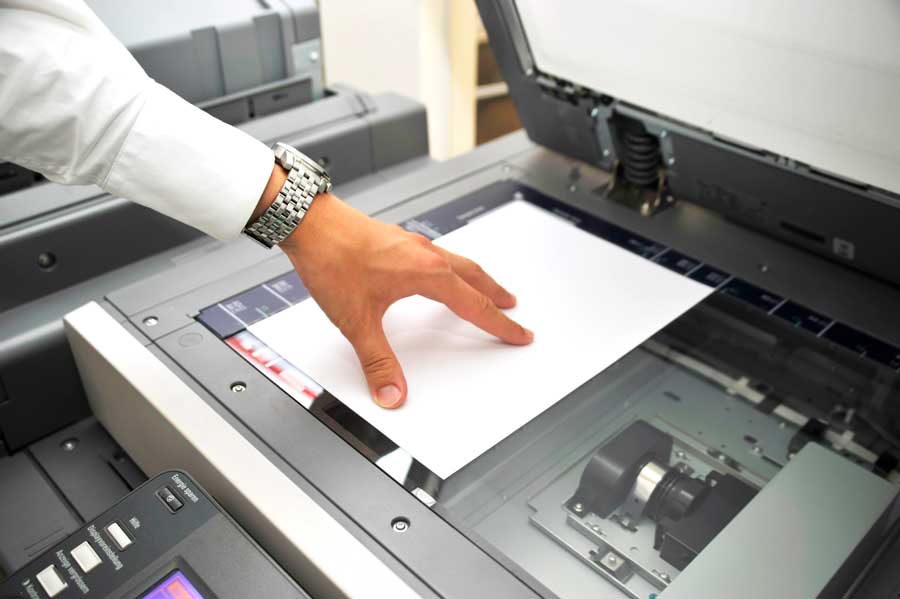 Person scanning a document.